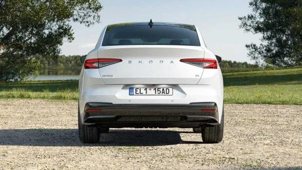 A 2024 Skoda Enyaq painted in white with the photo showing the full rear end of the coupe model