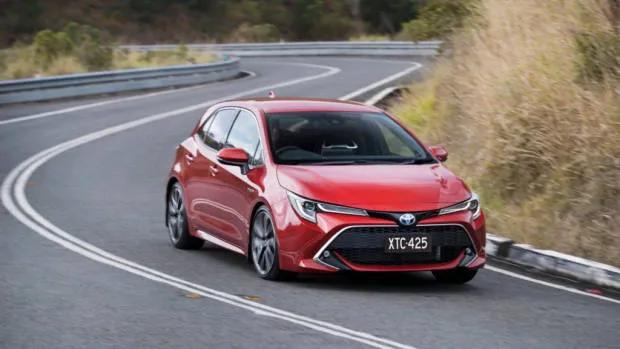 2019 Toyota Corolla ZR hybrid red front 3/4 driving