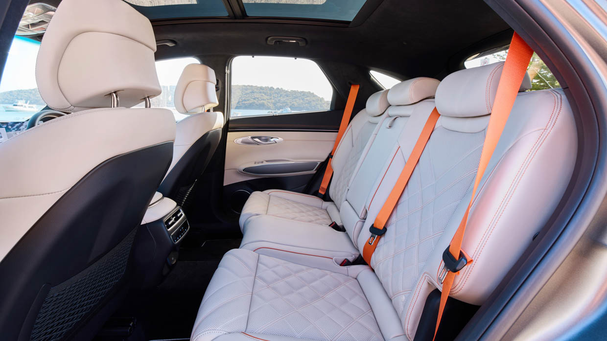 2025 Genesis GV70 Signature Sport side angle interior back seat