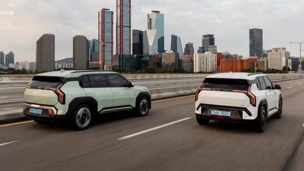 2025 Kia EV3 duo rear angle driving shot